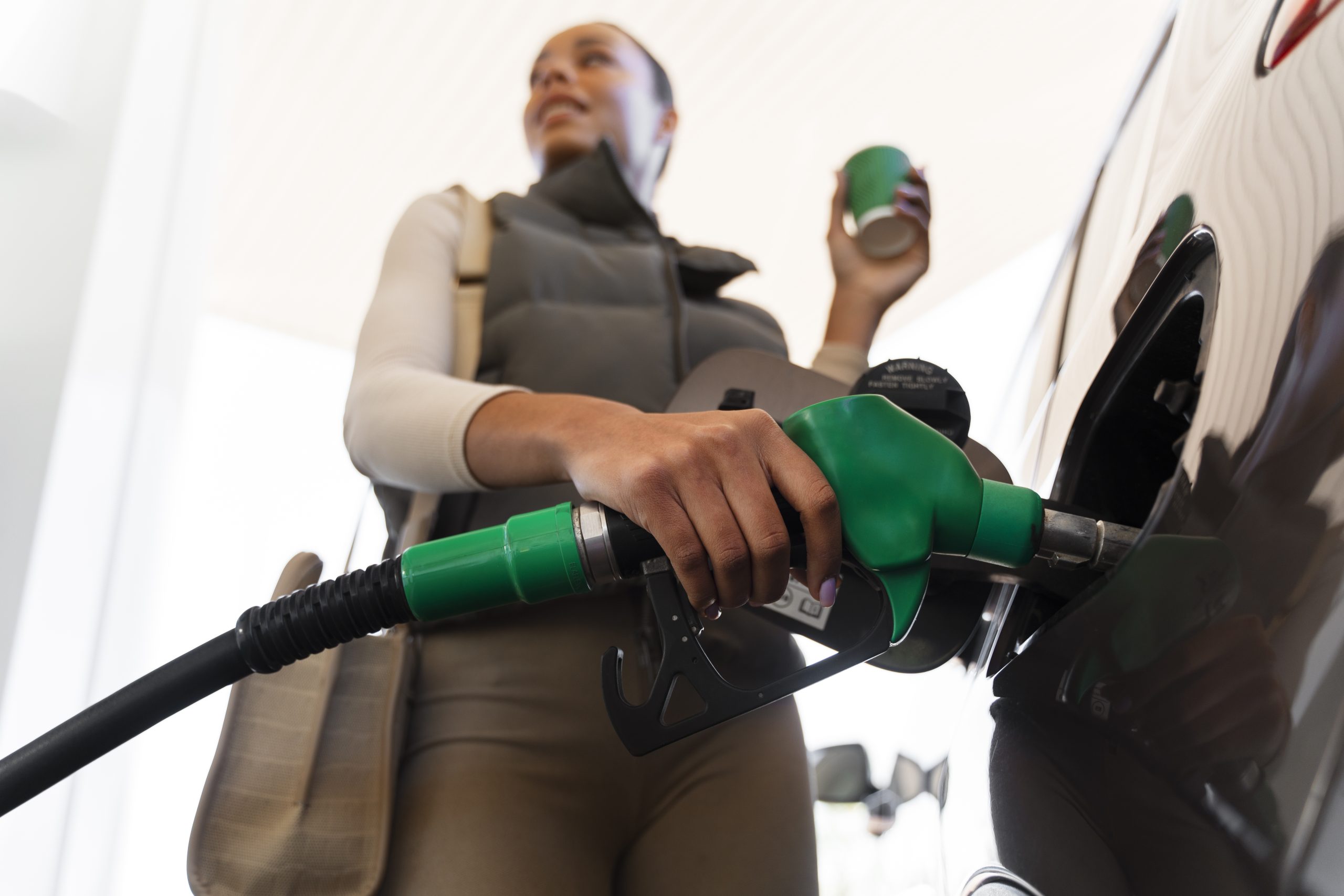 view-woman-with-car-gas-station (2)